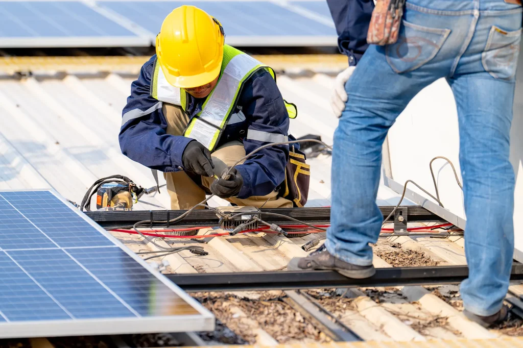 workers installing solar panels for efficient ene